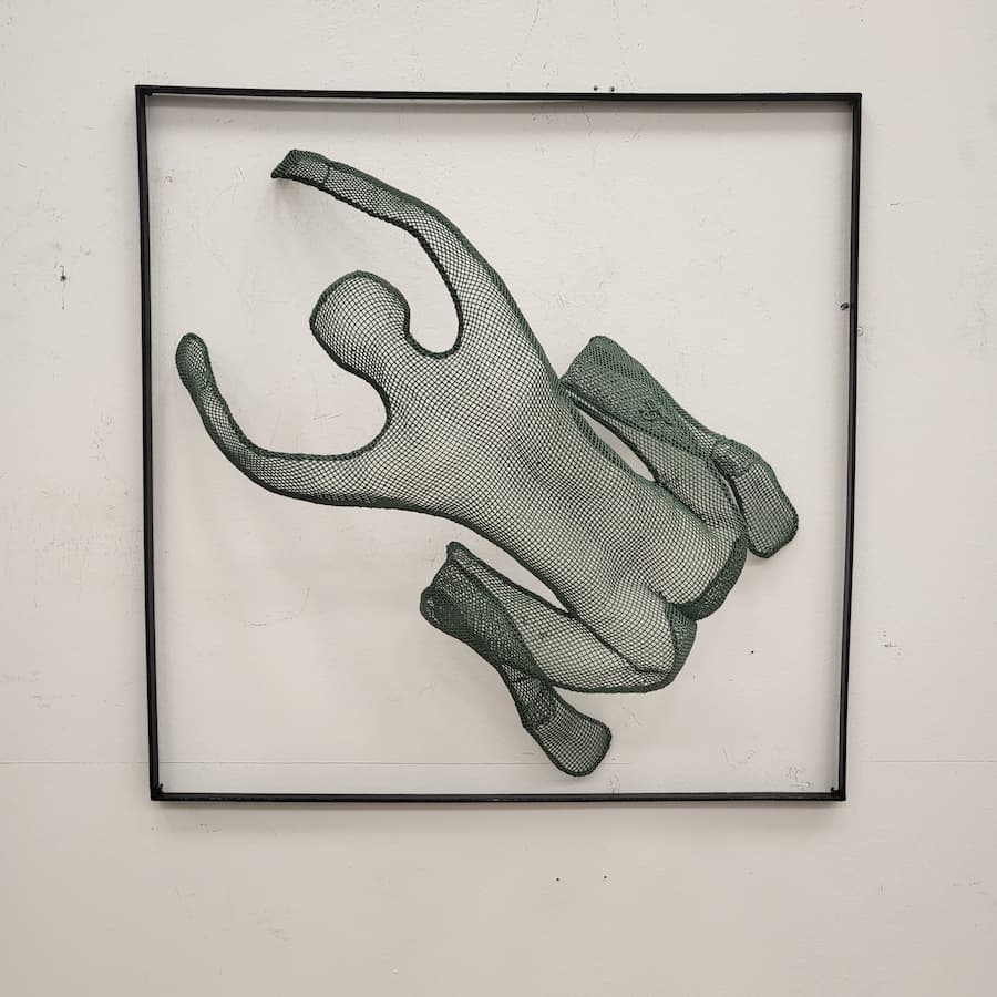 2222- Green wall climber in a frame